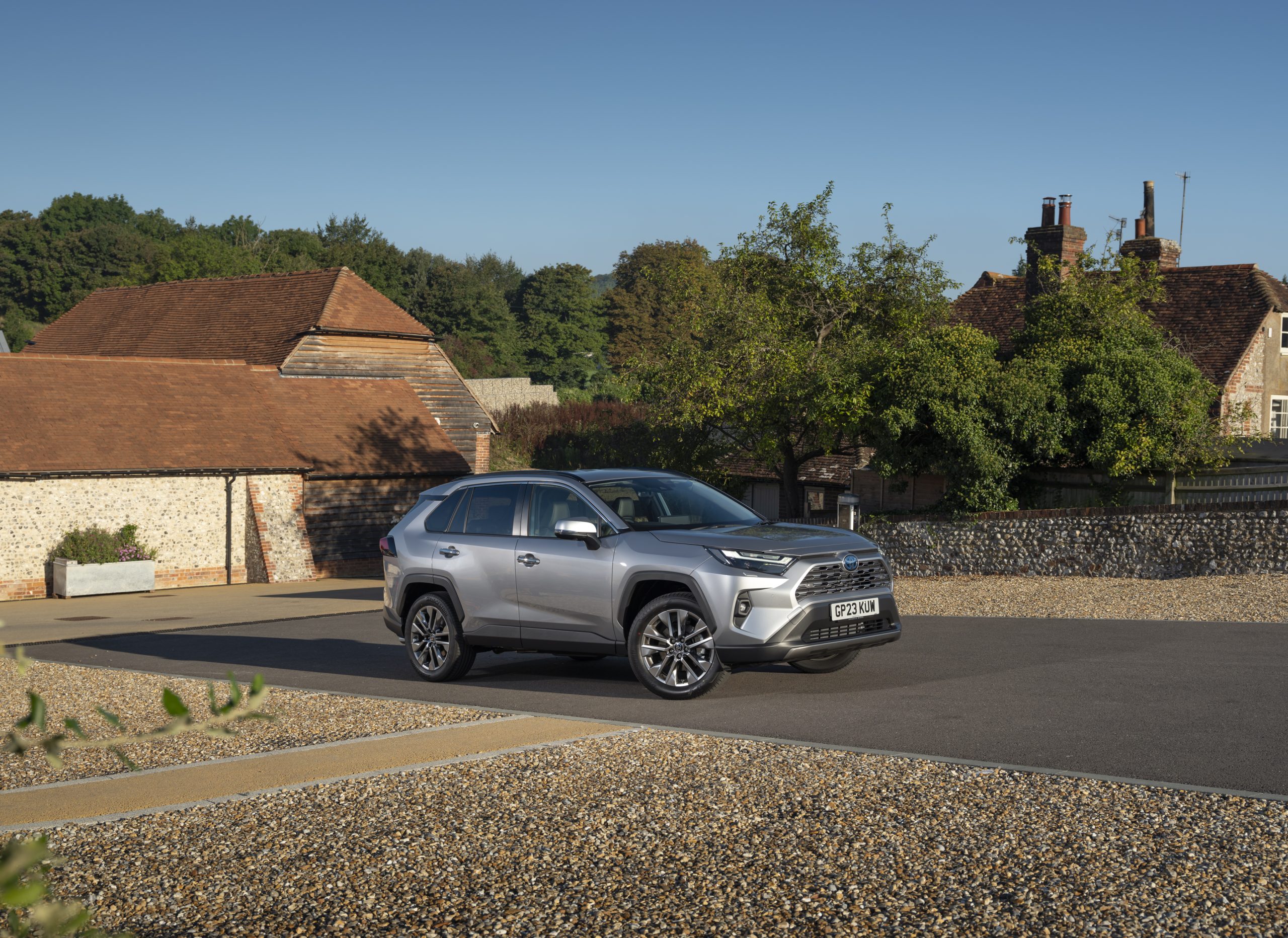 Silver Toyota RAV4 Hybrid in an official manufacturer photograph